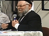 הרב גרילק נואם בכינוס (צילומסך)